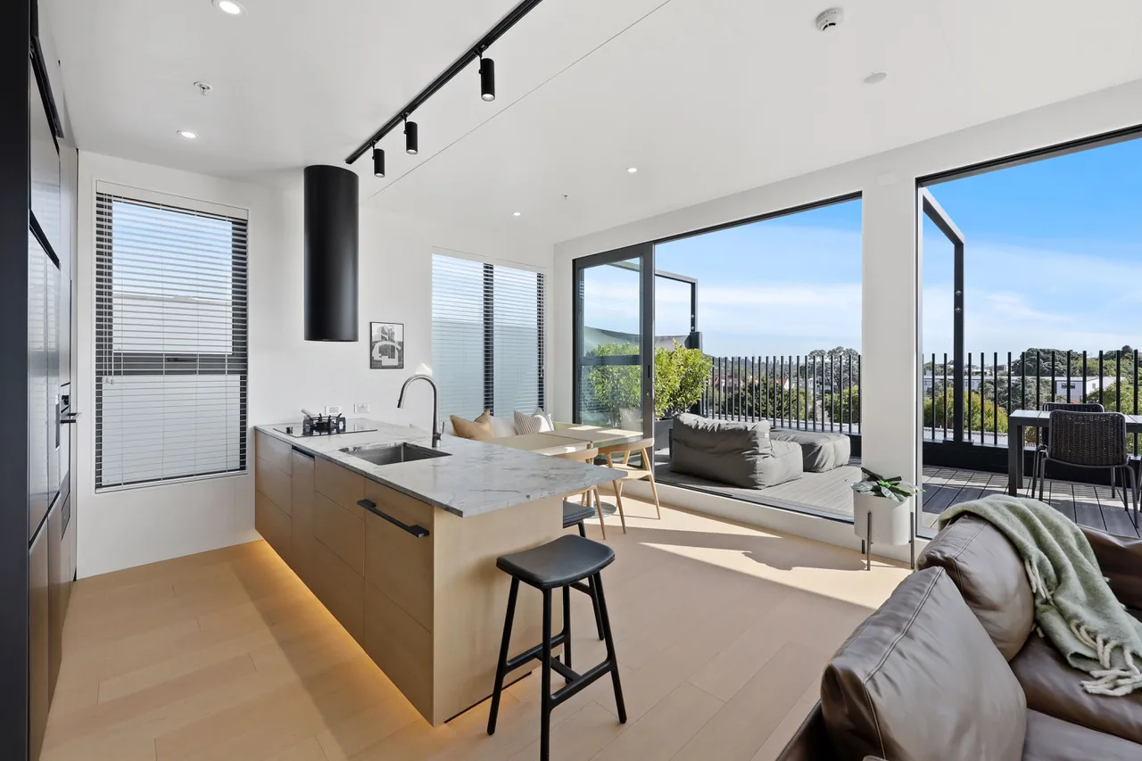 The kitchen island at Penthouse 505, looking through to the living area and terrace