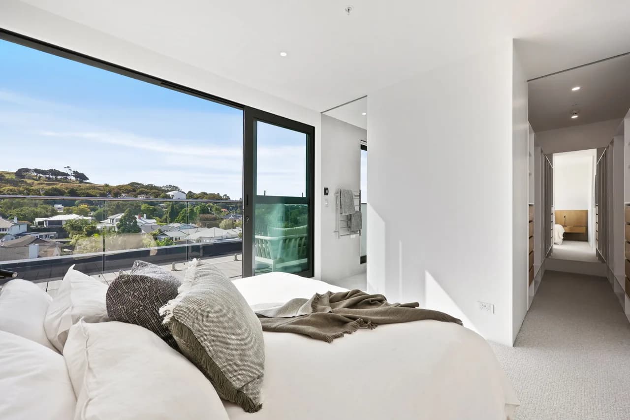 The master bedroom at Penthouse 505, looking from the bed out along the hall