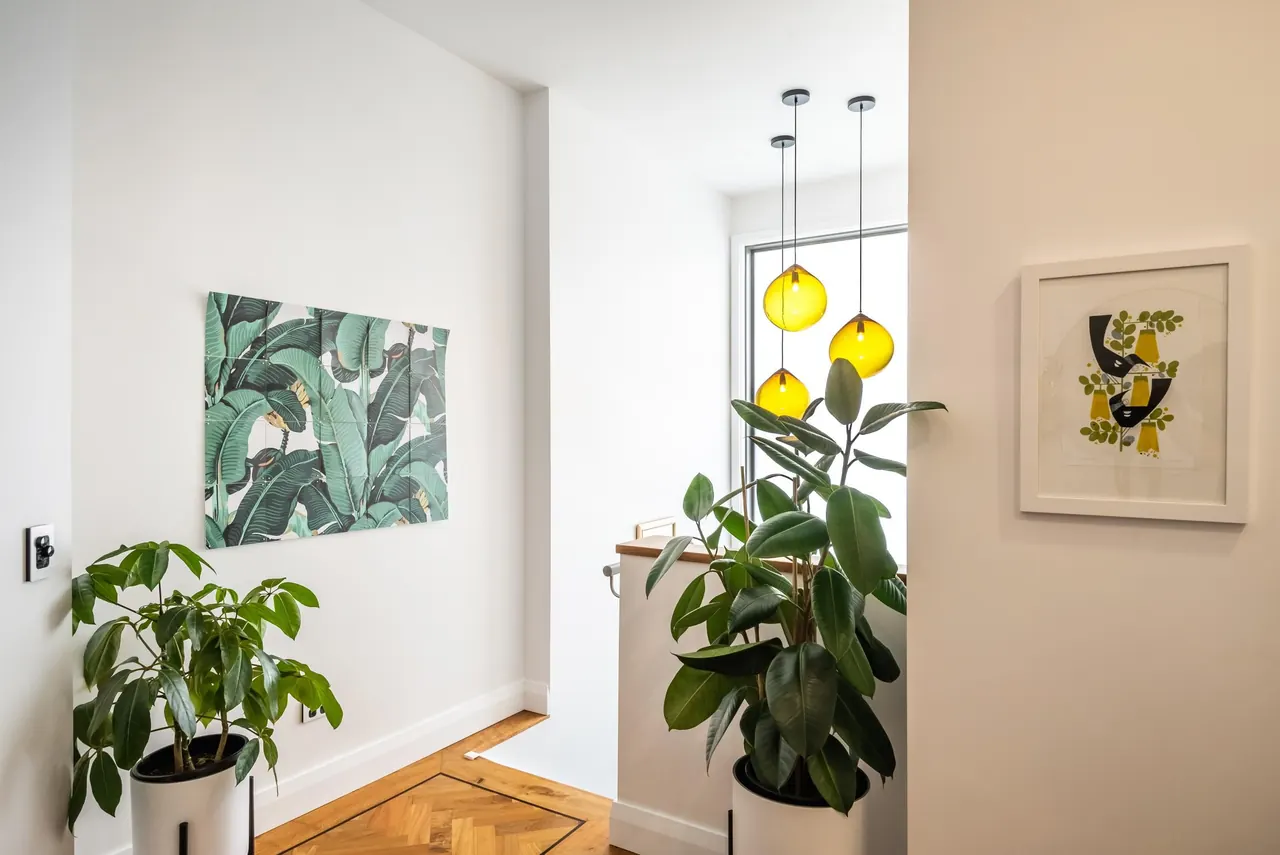 The entry of Penthouse 504, with walnut parquet and pendant lights