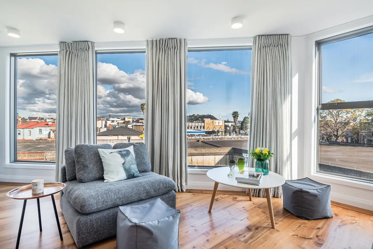 The downstairs living room, with windows on two sides