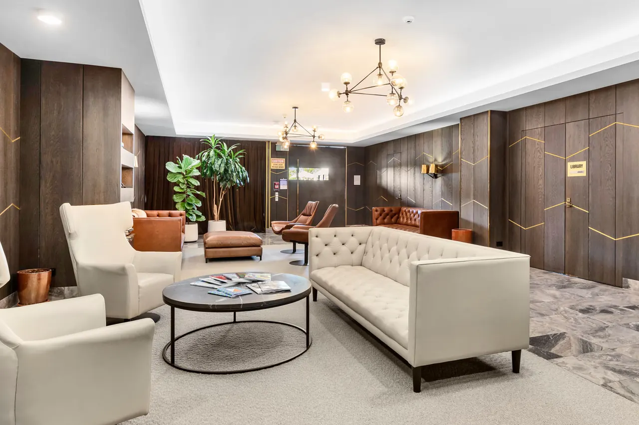 The Western Park lobby lounge, with timber panelling and tufted sofas