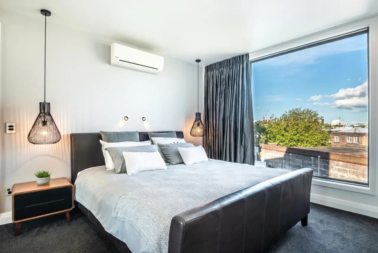 The master bedroom of Penthouse 504, which gets the morning sun